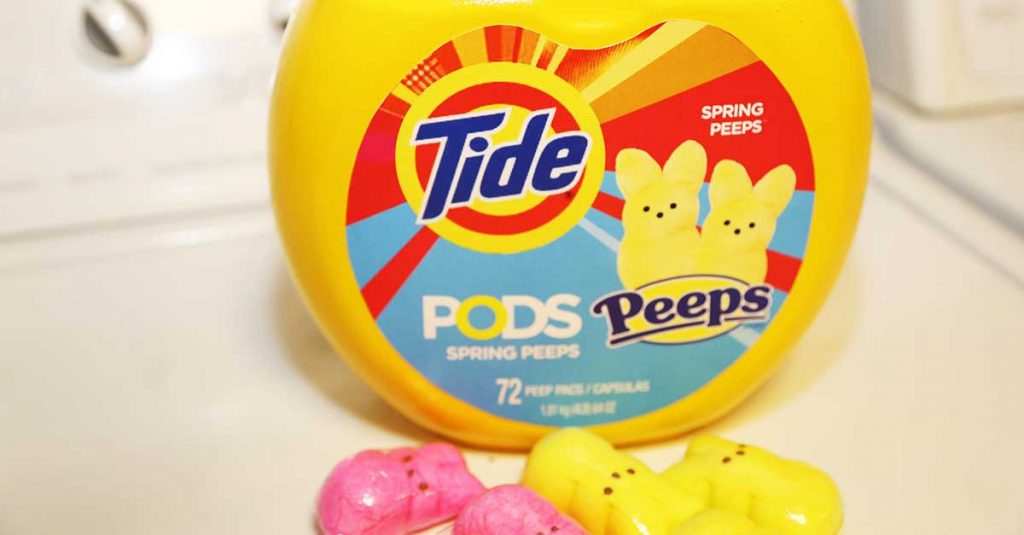 Tide's Peeps Pods container on top of a laundry machine