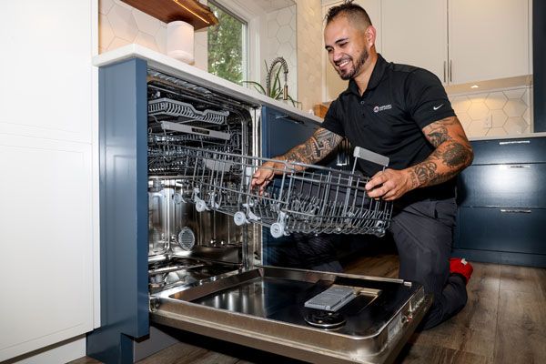 Hometown Hero Appliance repair expert technician servicing a dishwasher in Des Moines